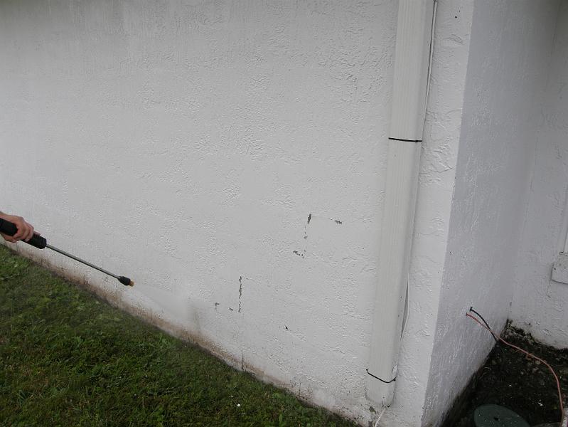 03Power Washing House to Reveal Cracks.JPG